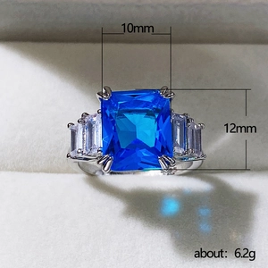 Silver ring with 10x12mm blue rectangular stone and side clear diamonds in a gift box