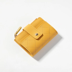 Yellow quilted leather mini wallet with zipper pocket and metal snap closure