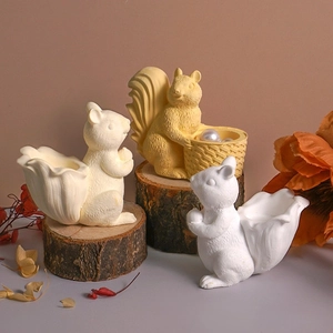 Detailed resin squirrel storage pots and molds displayed on natural wood logs with flowers