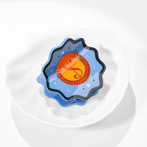 Blue acetate flower hair claw with orange money bag design and gold dollar sign