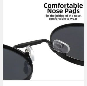 Detail view of round steampunk sunglasses showing soft silicone nose pads and metal frame