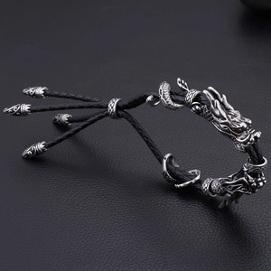 Bracelet vintage en cuir tressé pour homme avec deux têtes de dragon en finition antique