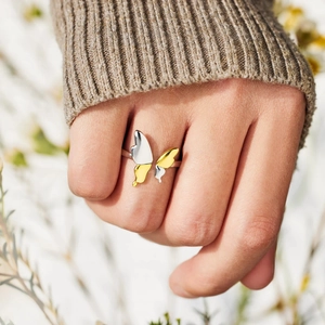 Elegant S925 sterling silver butterfly ring with two-tone finish worn in a natural setting