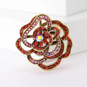 Elegant red floral brooch with vintage gold finish and sparkling rhinestones for suits