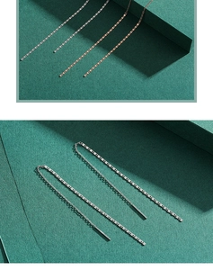 Detail of rose gold and silver minimalist s925 long chain threader earrings