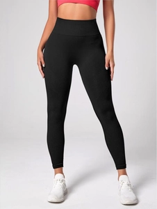 Detail of high-waist seamless leggings showing textured breathable mesh and ribbed support