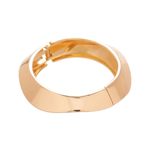 Polished gold wide open bangle with a modern minimalist geometric curved design for women