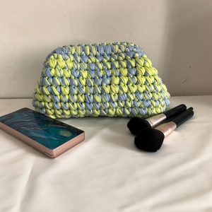 Handmade crochet cloud bag in blue and yellow knit with a side phone and makeup brush
