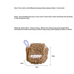 Detailed view of brown plush mini earphone case with purple lanyard and logo label