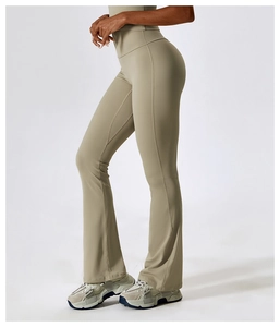 Detail view of high-waisted flared yoga pants with body-shaping fit and lift effect