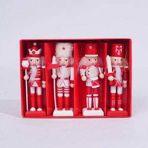 Set of four red and white wooden nutcracker soldiers in a red gift box display