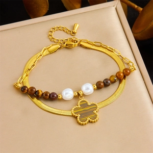 Dual-layer gold snake chain bracelet with brown tiger eye beads and flower charm