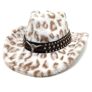 Close-up of leopard print texture and metal bull head pendant on western cowboy hat
