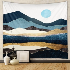 Detailed view of abstract mountain wall tapestry with blue and gold textured patchwork