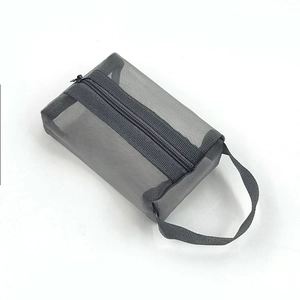 Close-up of light grey mesh mini makeup pouch with durable zipper and reinforced strap