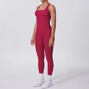 Side view of red two-piece yoga set with racerback top and high-waisted gym leggings