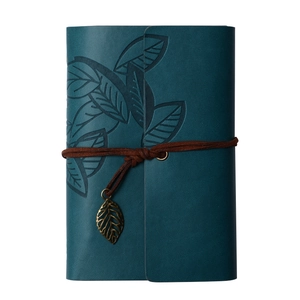 Vintage lake blue leather traveler notebook with leaf embossing and bronze leaf pendant