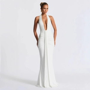 Elegant white halter neck dress with deep V-neckline and flattering ruching details