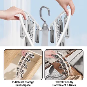 Foldable white drying rack with 12 clips for socks and underwear, ideal for travel storage
