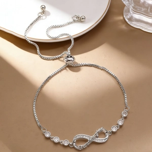 Detail of adjustable infinity bracelet with Granddaughter engraving and zircon stones