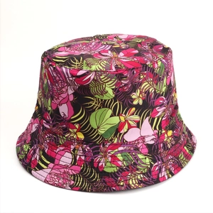 Detailed top view of the vibrant floral print on a cotton reversible bucket sun hat