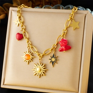 Gold star and red heart pendant necklace displayed on a premium beige leather stand