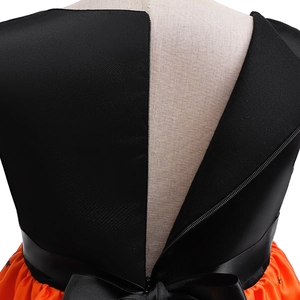Detail of girls' Halloween pumpkin dress back with black bow and zipper closure