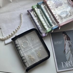 Detail of multi-color PVC jewelry organizers with zippers and loose-leaf transparent pockets