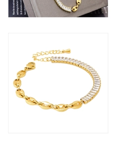 Detail of gold bracelet with pig nose chain links and rectangle zircon stone inlay