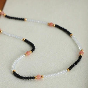 Handmade necklace with natural stones, colorful faceted beads and golden accents