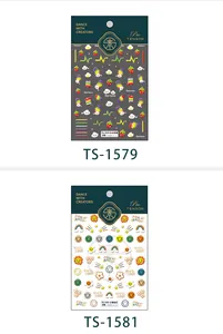 Detailed view of TS-1579 and TS-1581 3D nail stickers featuring rainbow and smiley designs