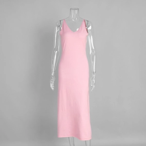 Detail of pink knitted V-neck slip dress with slim fit design and fine ribbed texture
