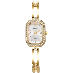 Montre bracelet élégante en or pour femme avec lunette octogonale en strass