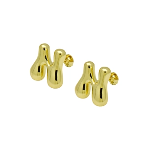 Detailed view of chunky golden letter N balloon earring with smooth polished finish