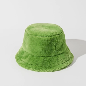 Detail showing the grass green faux fur texture and thick plush fabric of the bucket hat