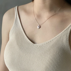 Minimalist 925 sterling silver heart pendant necklace in gold finish on female model