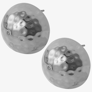 Macro detail of silver hammered texture on minimalist dome stud earrings for women