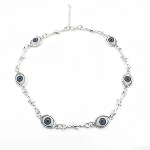 Gothic silver devil eye pendant necklace with barbed wire design on white background