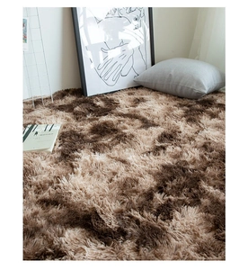 Close-up of soft plush brown and beige gradient round rug in a cozy living room setup