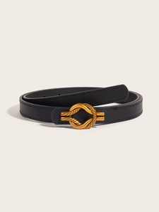 Close-up of black PU leather thin belt for women with elegant golden knot buckle design