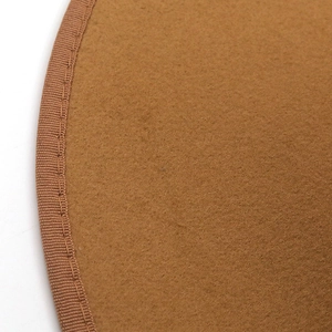 Detailed close-up of brown wool felt hat brim with reinforced stitched edge craftsmanship