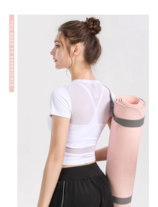 Detail of white yoga top featuring breathable mesh splice back design for sports
