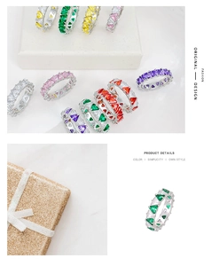 Detailed close-up of colorful heart and triangle cut zircon rings on a white display stand
