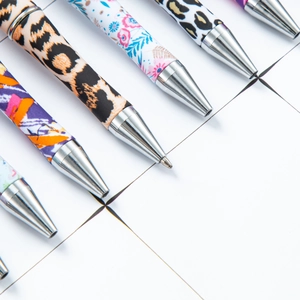 DIY plastic beaded ballpoint pens with leopard, floral, and cow prints and metal tips