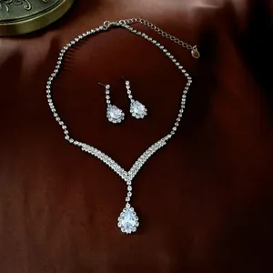Sparkling silver-tone V-shape bridal jewelry set with pear-cut teardrop crystals