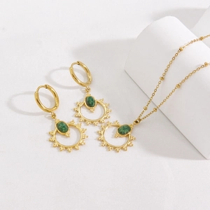 Vintage gold 14K plated titanium jewelry set with green oval sunburst pendant and earrings