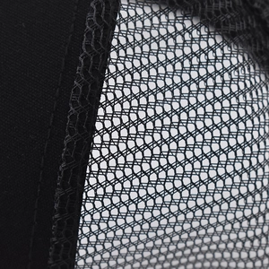 Close-up of black breathable mesh fabric and durable stitching on a Brooklyn baseball cap