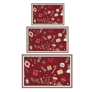 Three sizes nested Christmas trays with red festive patterns and light brown frames