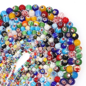 Colorful Millefiori glass beads arranged in a spiral pattern for DIY jewelry making