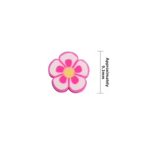 Dettaglio perla a fiore di prugna in argilla polimerica rosa 9,3 mm per gioielli fai da te